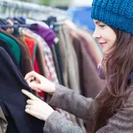 a woman volunteers at a thrift store